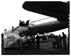 Johannesburg, May 1953. Palmietfontein Airport. Mr Brown and son alighting from SAA Douglas DC-4 ...