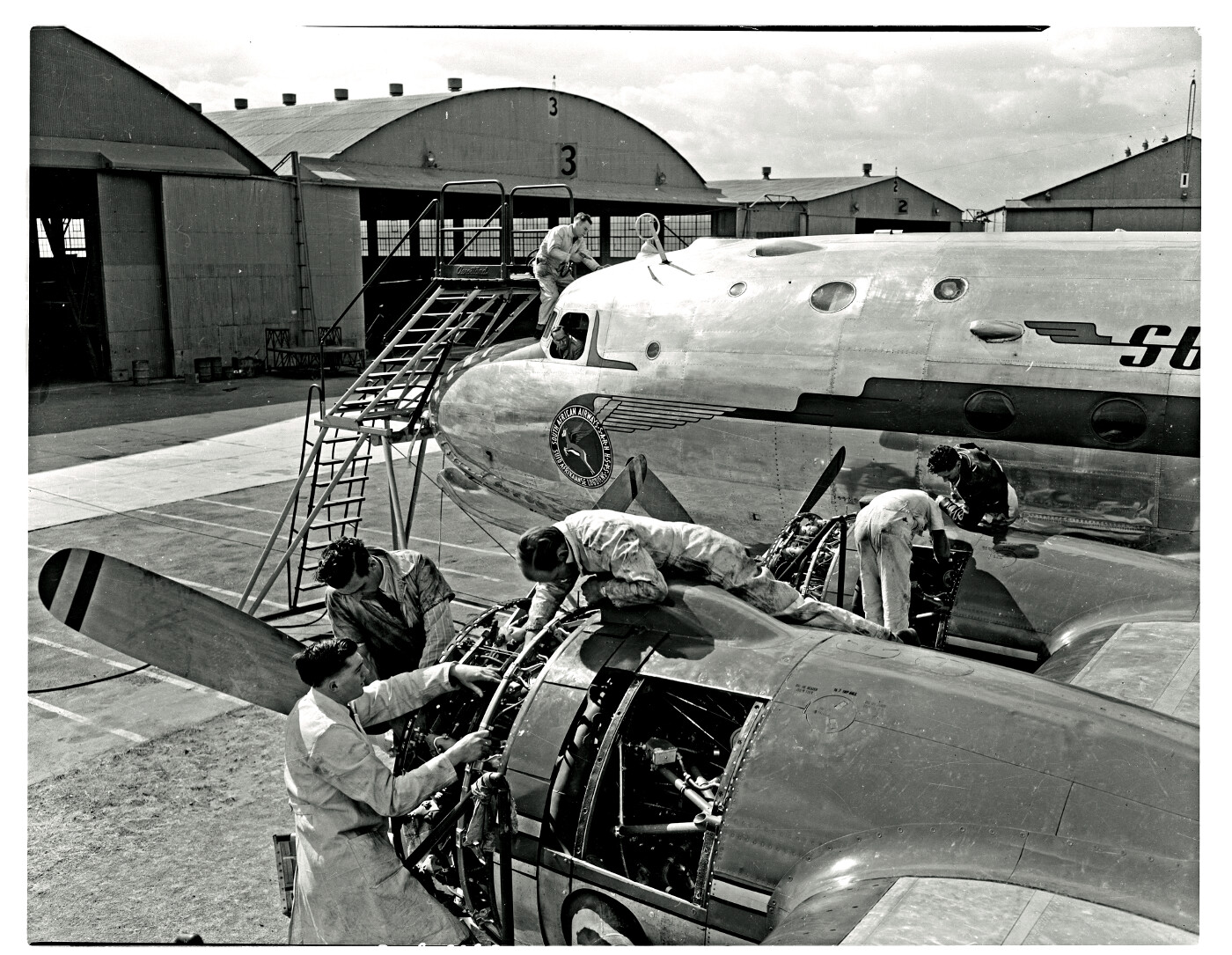 SAA Douglas DC-4 undergoing maintenance outside. - Atom site for DRISA