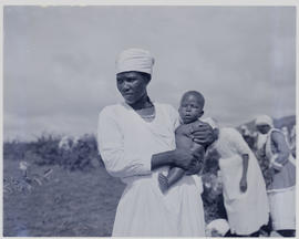 Durban, 1951. Woman dressed for religious occasion with baby.