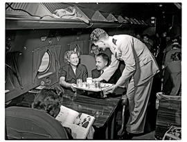 
SAA Douglas DC-4 interior. Cabin service, steward.
