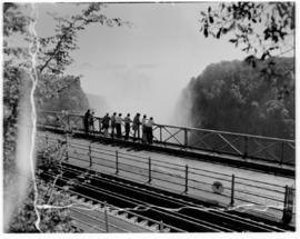 Victoria Falls, Southern Rhodesia, 12 April 1947. Press corps on railway bridge.