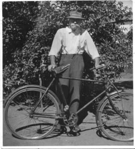 'Charlie' Schalk Johannes Liebenberg, engine driver, with bicycle.