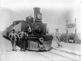 Cullinan, 1908. Three men with NZASM locomotive and coaches at station.