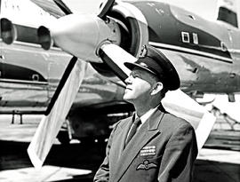 
Pilot standing next to engine and propeller of SAA Vickers Viscount.
