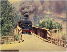 Lesotho, January 1980. SAR Class 19D with mixed train crossing SA - Lesotho border at Caledon Riv...