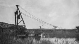 Wilderness, circa 1926. Duive River bridge construction: Driving the last pile for the temporary ...
