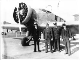 Union Airways Junkers W34 ZS-AEC 'Sir George Grey' with men posing.
