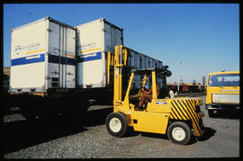 
Forklift loading containers.
