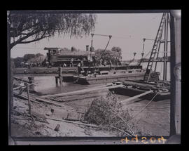 Upington, February 1915. Steam locomotive crossing the Orange River by pontoon during World War One.
