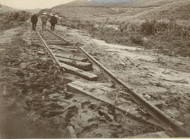 Damaged railway track and embankment after floods.