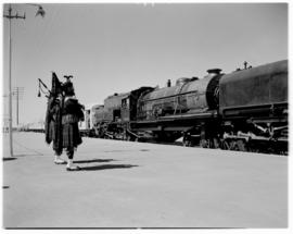 Rhodesia, April 1947. Two pipers saluting the Royal Train on station platform.