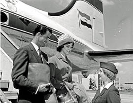 
Passengers greeted by hostess at bottom of stairs. Douglas DC-4 ZS-BMH. Note Skycoach emblem.

