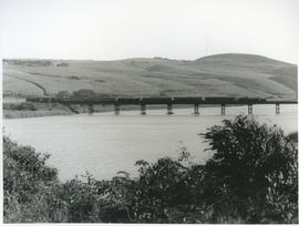 Port Shepstone, 1935. Passenger train on bridge over Umtentweni River.