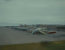 Johannesburg, 1962. Jan Smuts Airport. Aircraft lined up on the apron. Boeing 707, DC-7B, Viscoun...