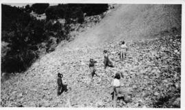 Worlers on steep rocky slope. (Lund collection)
