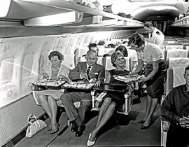 
SAA Boeing 707 interior. Cabin service. Steward and hostess.
