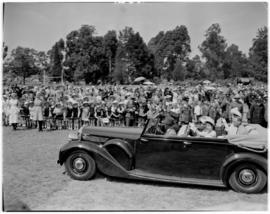 Vryheid, 24 March 1947. Royal family in open car waving to the crowd in the stadium.