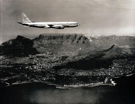 Cape Town, 1960. DF Malan airport. SAA Boeing 707 ZS-CKC 'Cape Town' over city. Note painted engi...