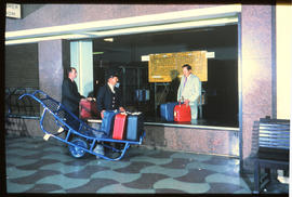Johannesburg, 1973. Porter delivering luggage to baggage room at Park Station. [S Mathyssen]