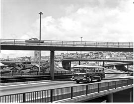 Port Elizabeth, 1968. SAR Mercedes Benz tour bus at freeway interchange.
