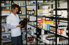 Pharmacist inside SAR medicine depot.
