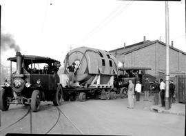 Johannesburg, 1935. Two Foden steam tractors with 56 ton turbine condenser turning into Bree Stre...