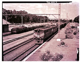 Springs district, 1965. SAR Class 5E1 Srs 1 with goods train at Sundra.