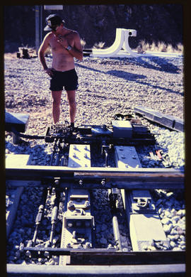 November 1994. Man standing at railway track switch.