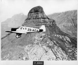 Cape Town, 1934. SAA Junkers F13 ZS-AEA 'Hendrik Swellengrebel' flying past Lion's Head. NOTE: Th...