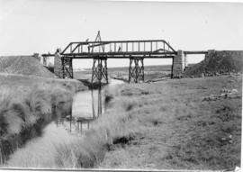 Circa 1893. Assembly of steel trusses using temporary intermediate piers. (NZASM album of BJC van...