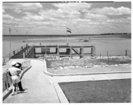 Vaal Dam, circa 1949. Arrival of BOAC flying boat Solent G-AKNS. Jetty with aircraft in the dista...
