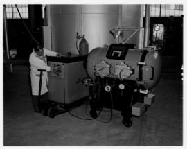 Johannesburg, February 1970. Technician with pressure vessel in workshop at Jan Smuts Airport.