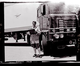 
Driver standing at SAR ERF refrigerator truck No MT80563. ERF = Edwin Richard Foden.
