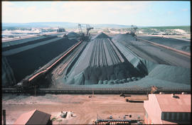 Saldanha Bay, 1977. Iron ore stockpiles at Saldanha Bay harbour.