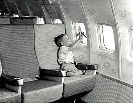 
SAA Boeing 707 ZS-CKC interior. Boy with 707 model.
