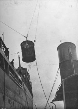 Passengers being lowered in basket lift.