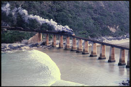 Wilderness district. Steam locomotive with mixed train on Kaaimansrivier bridge.