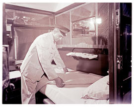 "1960. Blue Train bedding attendant."