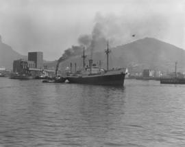 Cape Town, 1966. Tug with 'Frontier' in Table Bay Harbour.