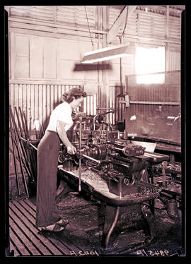 Female machinist in mechanical workshop.