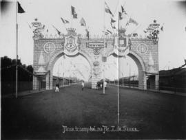 Royal tour by Crown Prince of Portugal, July 1907. Arch in wide street.