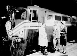 Johannesburg, 1966. Driver speaking to passingers next to SAR Class ? On station platform.