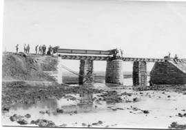 Circa 1893. Placement of bridge deck beams. (NZASM album of BJC van Rossum)