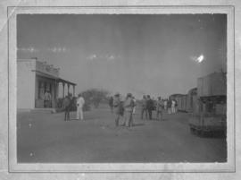 Okasise, South-West Africa, before 1914. Men and train in station.