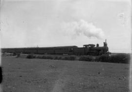Cape Town. SAR Class 03 'Wynberg tender' locomotive on suburban train of mainly ex CGR coaching s...