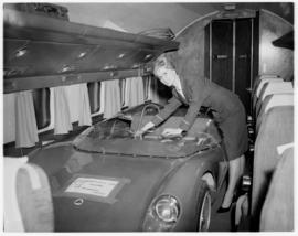 Johannesburg, October 1962. Jan Smuts Airport. A Lotus 23 Sports Car strapped into the passenger ...