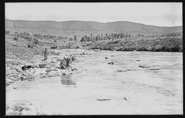 "Waterval-Boven. Washing clothes in the river."