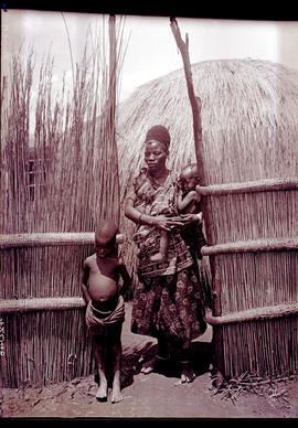 Swaziland, 1933. Swazi mother with her children in doorway.