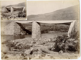 Two steel bridge spans on stone abutments and pier.