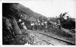 Workers clearing away rubble from track after landslide. (Lund collection)